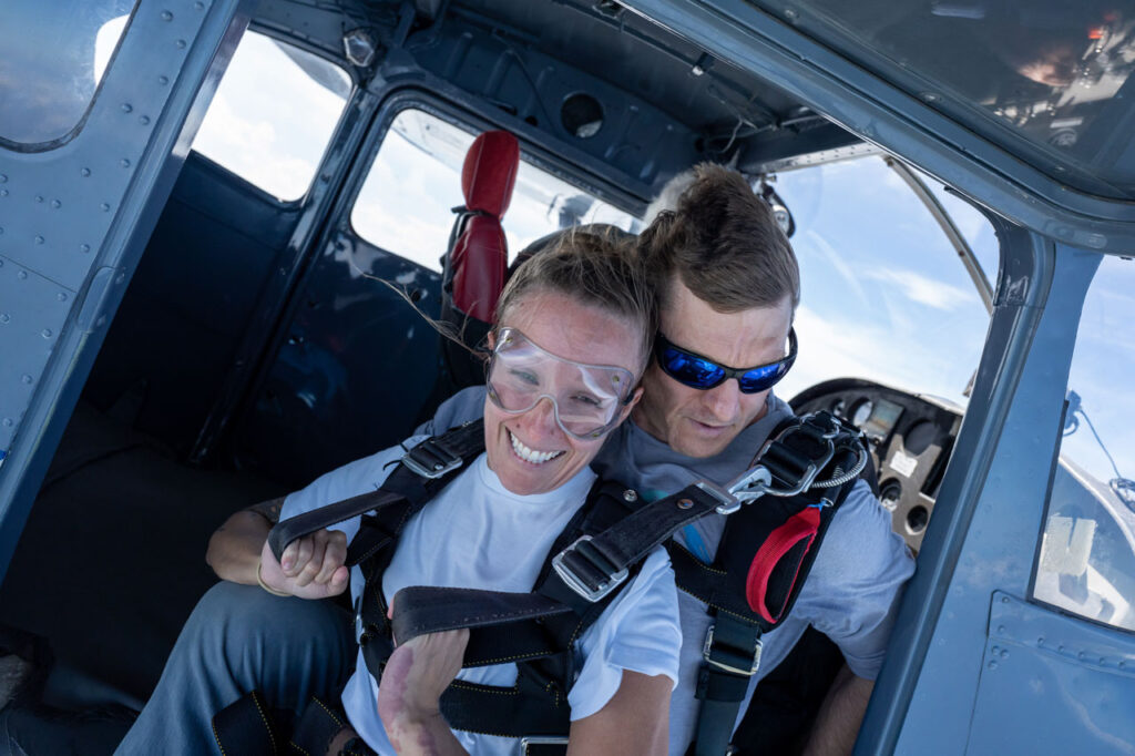 Couple in training gear listening to ground school instructions together