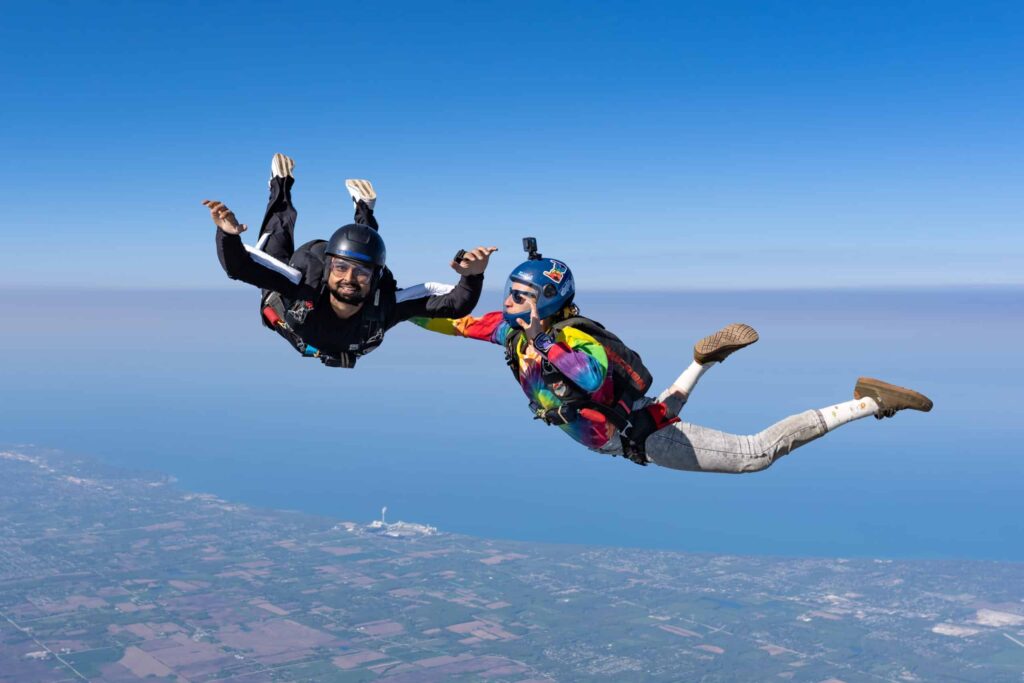 Progression photos showing skydiver from first tandem through solo certification