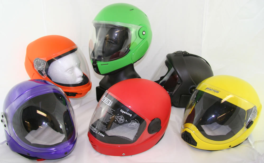 Side-by-side comparison photo of all reviewed helmets with size reference