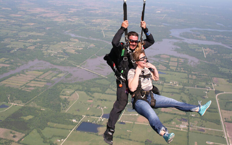Aerial view of Kansas plains from skydiving altitude showing patchwork farmland