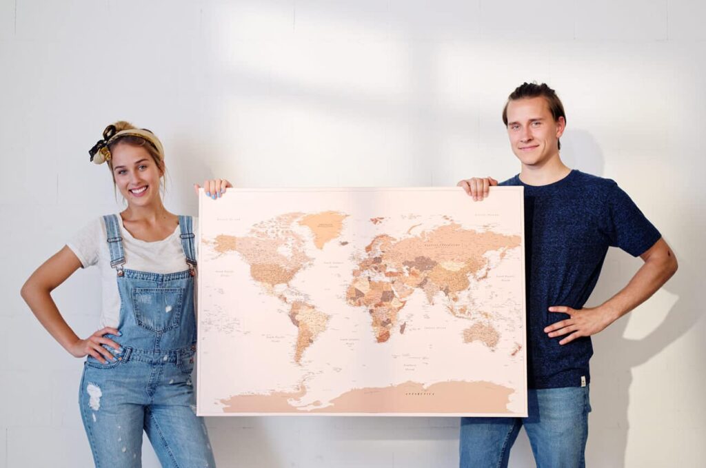 Couple reviewing adventure planning checklist with roses and map