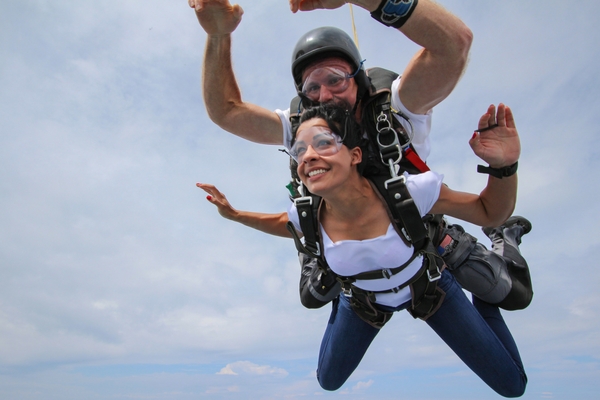Happy skydiver after landing, showing post-jump euphoria