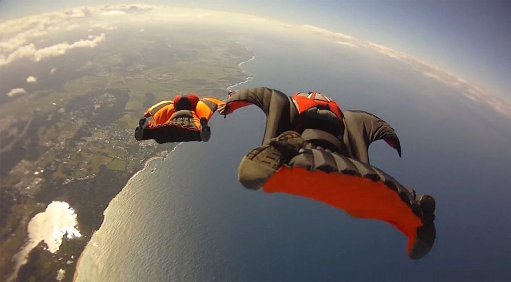 Side-by-side comparison of traditional skydiving deployment vs. wingsuit deployment sequence